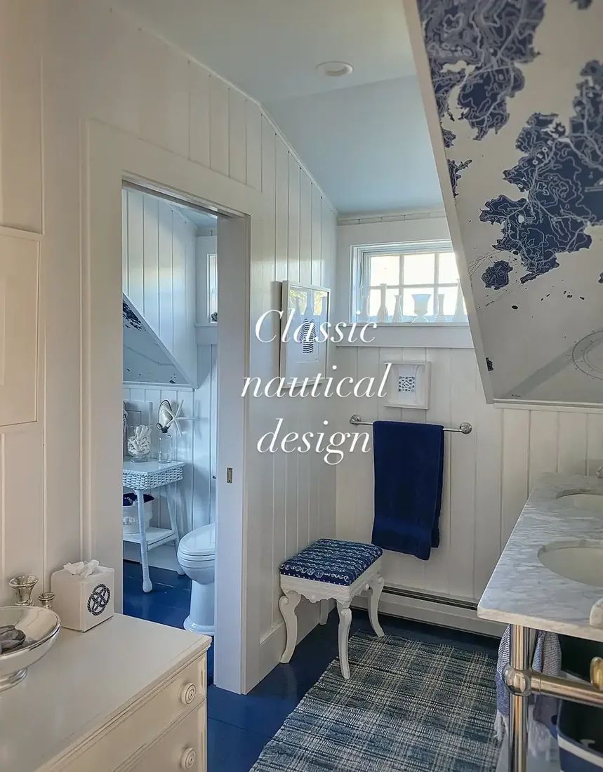Narrow eaved bathroom with white boarding, blue painted floor and marble top