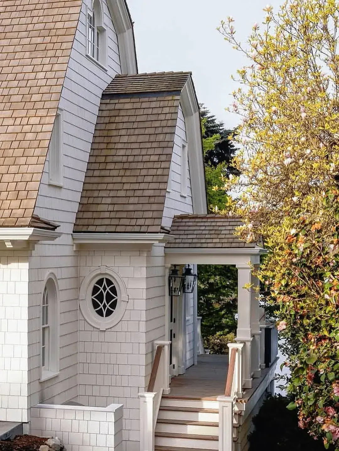 White house exterior with a cedar shake roof