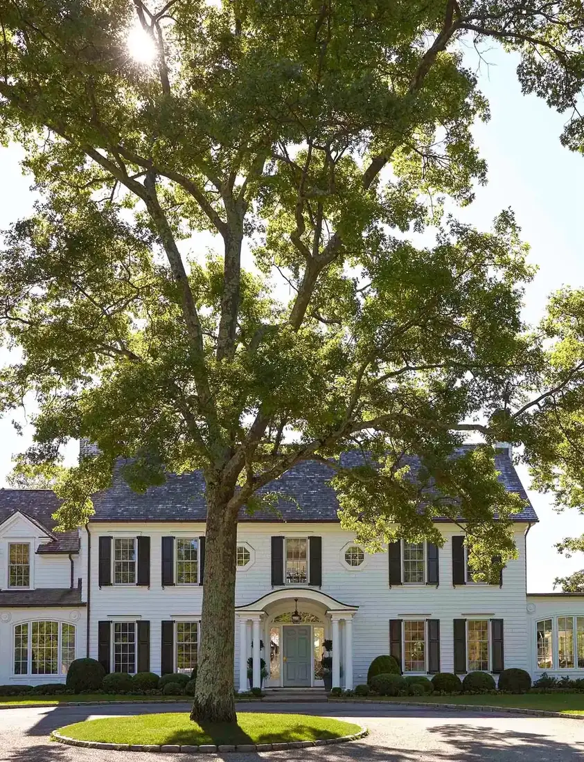 White colonial house exterior with strong kerb appeal and clipped front garden