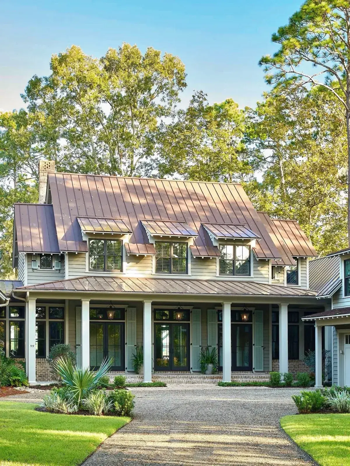 Pale green lowcountry house with a copper roof detail