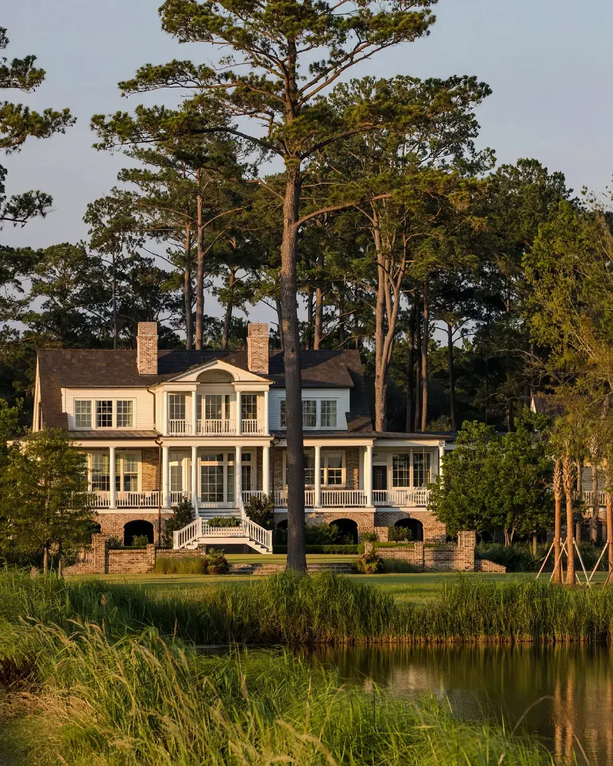 Yellow lowcountry house with a double porch facing the marsh