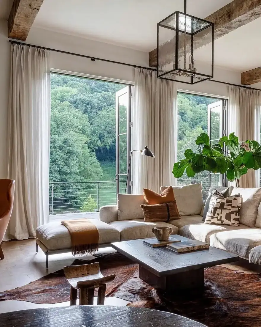 Valley view room with linen sectional, hide rug and iron windows
